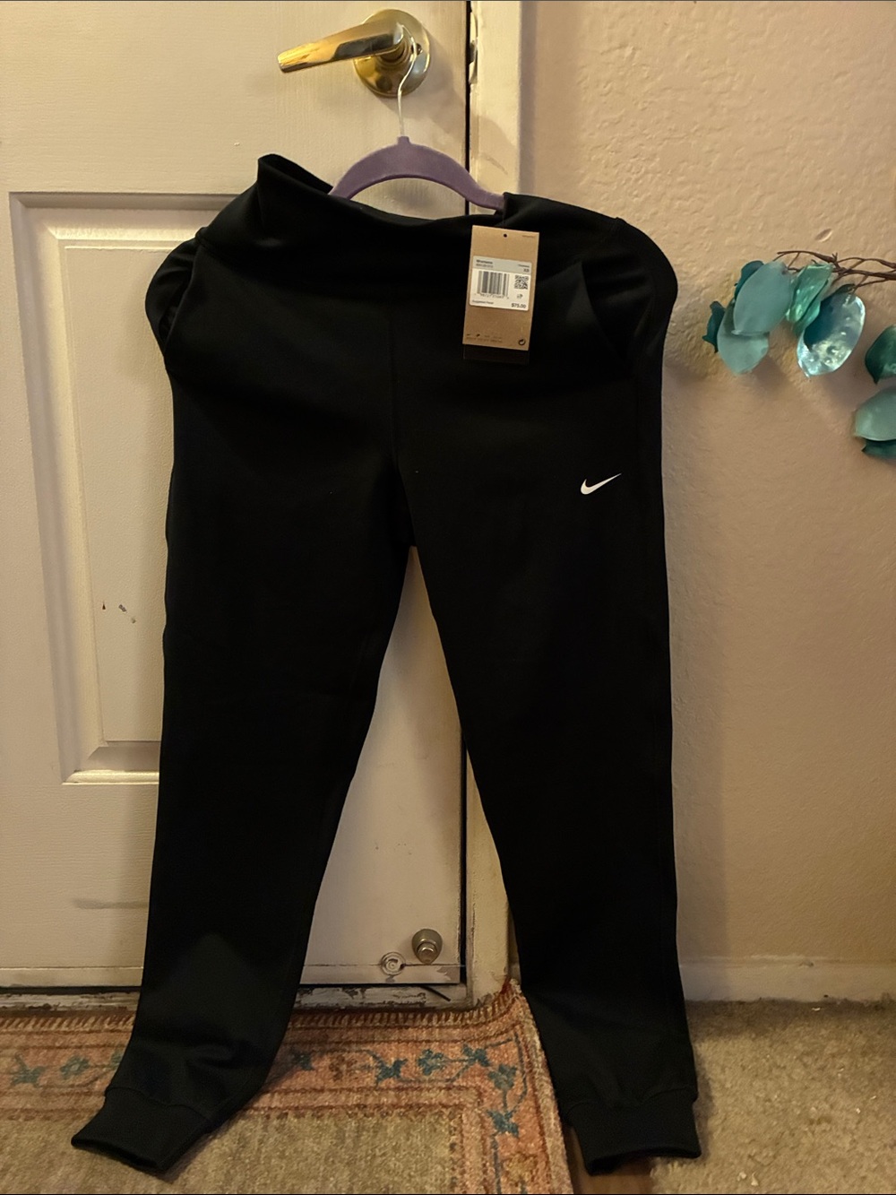 Nike Black  women’s Performance Joggers with White Swoosh